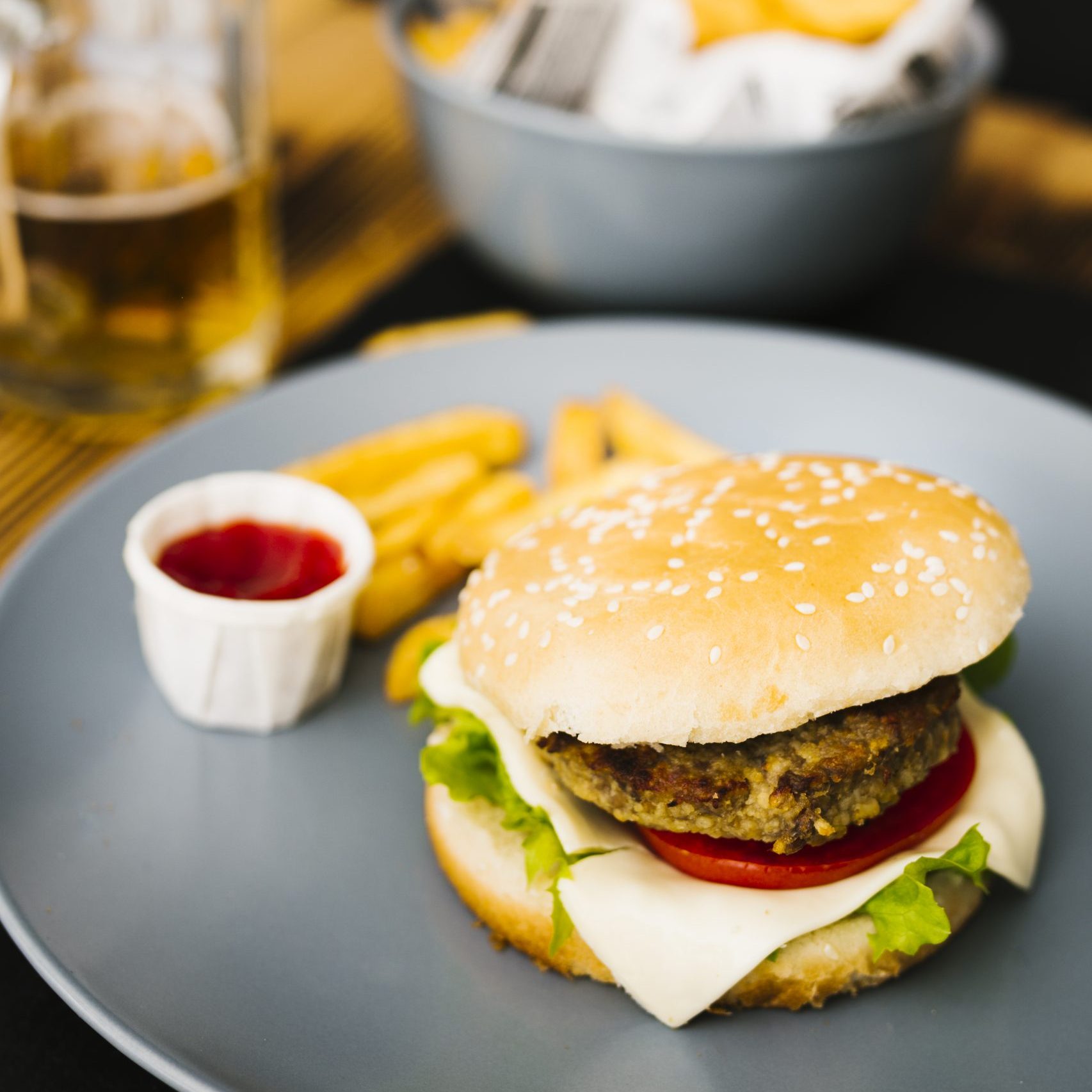 high-angle-close-up-burger-with-fries-plate